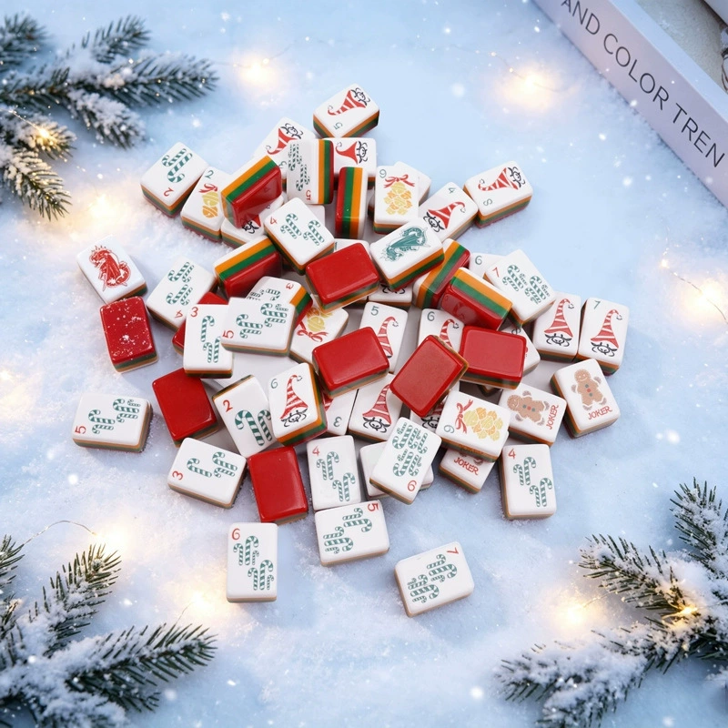Christmas mini American Mahjong tiles arranged on a snowy surface