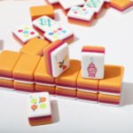 Close detail of four-layer acrylic American Mahjong tiles on a white background