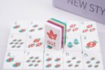 Close view of a glossy four-layer acrylic Christmas American Mahjong tile