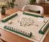 Beginner American Mahjong lesson table setup with tiles racks and mat